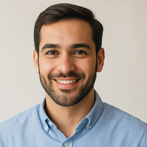 Four individuals from different cultural backgrounds are smiling against a neutral background.